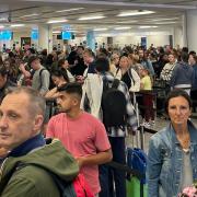 Passengers queue at Gatwick following the issue with e-gates.