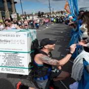 Stevenage runner Daniel Fairbrother got down on one knee to propose to his girlfriend at mile 25.