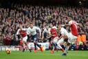 Arsenal's Pierre-Emerick Aubameyang scores his side's first goal of the game during the Premier League match at Emirates Stadium, London.