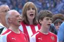Peter Gosnell (left) and his grandson Edwin sing their hearts out at Wembley