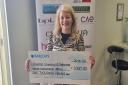 Hertfordshire Chamber of Commerce CEO Briege Leahy with the £1,000 cheque for the Disasters Emergency Committee's Ukraine Humanitarian Appeal.