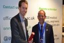 Royston scientist Dr Peter Charlton, pictured when receiving an award from Professor Mark Tooley for the best paper published in journal Physiological Measurement, was invited to Parliament to discuss the potential benefits of using wearable sensors to co
