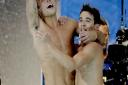 Britain's Tom Daley, left, and Daniel Goodfellow celebrate winning bronze after their final dive during the men's synchronized 10-meter platform diving final in the Maria Lenk Aquatic Center at the 2016 Summer Olympics in Rio de Janeiro, Brazil, Monday, A