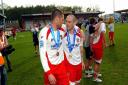 Michael Bostwick and Mitchell Cole celebrate Stevenage's promotion to the Football League in 2010.