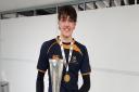 Hitchin Boys' School captain Reece Cairns shows off the U15 Schools Vase trophy.