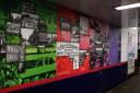 The commute through time exhibition features the underpass panels from Hitchin station