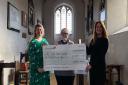 Emma McKenzie and Rev Amanda Ferris with Caroline Selley from Heckford Norton, who presented All Saints' Willian with £1,000 to go towards the church's restoration fund