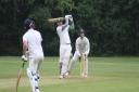 Ben Rotheram launches a six over the tennis courts for Datchworth against Dunstable II.