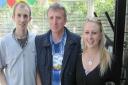Claire with brother Thomas Hill and dad Simon, who all have ulcerative colitis. Picture: Courtesy of Claire Osborne