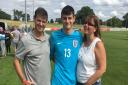 Goalkeeper Tom Smith with his proud parents.