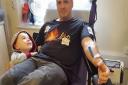 Martyn Batty of Knebworth gave his 50th blood donation on Father's Day. He is pictured with son Jared making his 49th donation.