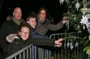 Chris, Emily, Tom Smith and Katie Fuller pictured  placing  their silver Lights of Love stars on the Welwyn Garden City Christmas tree.
Picture: Isabel Hospice.