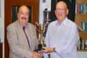 Mike Howe receives the men\'s championship trophy at Shire Park