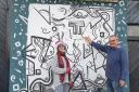 Hugh Tessier and Maria Fekete by Maria's new mural.