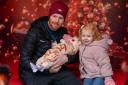 Families enjoy the Coca-Cola Truck's photo booth on Sunday in Baldock