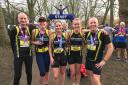 Katie Harbon (second right) with North Herts Road Runners team-mates after winning the Bedford 10.