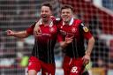 Josh March (right) celebrates with Kane Smith against Walsall. Picture: RHIANNA CHADWICK/PA