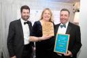 From left: Tom Burdett of LOCALiQ Eastern Counties, who presented the award, with Hannah and Ian Deane of Dairy Barns