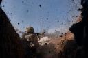 A Ukrainian soldier on the frontline during a battle with Russian troops near Bakhmut, Donetsk region (Libkos/AP)