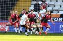 Stevenage stand and watch as Stevie Mallan slides Salford in front. Picture: DAVID LOVEDAY/TGS PHOTO
