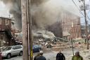 Rescuers are continuing the search for four people missing after an explosion at a chocolate factory in Pennsylvania which killed three people (Ben Hasty /Reading Eagle/AP)