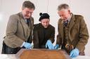 John McLeish and Peter MacDonald, of the Scottish Tartan’s Authority and James Wylie unveil Scotland’s oldest tartan will be displayed at V&A Dundee. (Alan Richardson/V&A).