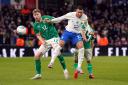 Republic of Ireland’s Nathan Collins, left, and France’s Kylian Mbappe (Niall Carson/PA)