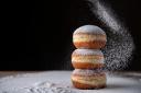 Doughnuts sprinkled with powdered sugar. Photo iStock/Getty Images Plus