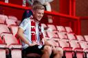 Harvey White in his Stevenage kit and scarf. Picture: RHIANNA CHADWICK/PA