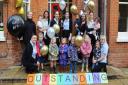 Staff and children from Highbury Lodge Day Nursery celebrate Ofsted success.