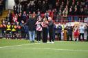 The sisters of Ollie Gatfield and Liam Sharpe address the crowd before Stevenage's game with Blackpool. Picture: TGS PHOTO