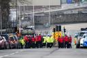 Emergency workers gather in Albert Road near to the Torpoint Ferry crossing in Plymouth, where a suspected Second World War explosive device, discovered in a garden in St Michael Avenue in the Keyham area of Plymouth, was taken by military convoy to the