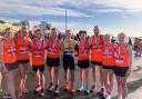 Katie Harbon (right) and Stuart Overton (fourth from left) of North Herts Road Runners were in the Herts 10k squad at Brighton. Picture: NHRR
