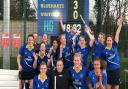 The ladies' third team at Blueharts Hockey Club celebrate promotion.