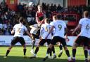 Carl Piergianni of Stevenage gets above the Salford City defence. Picture: DAVID LOVEDAY/TGS PHOTO