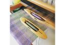 A weaving loom and shuttles from Liliane Textiles in Baldock