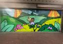 The mural, depicting the British countryside in spring, is designed to instil pride in residents and support local businesses.