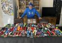 'Arnie the Turbanator' with his collection of marathon medals.