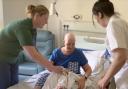 The rehabilitation and wellbeing service help a patient in the inpatient unit.