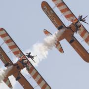 The AeroSuperBatics wingwalkers take to the skies at the 2018 Duxford Air Festival. Visit IWM Duxford this Spring Bank Holiday for the Duxford Air Festival. Picture: IWM