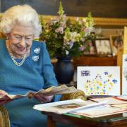 Queen Elizabeth II with memorabilia from her Golden and Platinum Jubilees at Windsor Castle