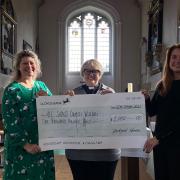 Emma McKenzie and Rev Amanda Ferris with Caroline Selley from Heckford Norton, who presented All Saints' Willian with £1,000 to go towards the church's restoration fund