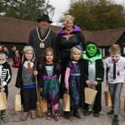 Chairman of North Herts district council John Bishop and Knebworth House operations manager Trish Washer with the pumpkin and Halloween costume winners at the Knebworth House Pumpkin Trail & Treats 2018. Picture: DANNY LOO