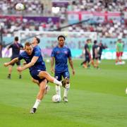 England's Harry Kane warms up ahead of the FIFA World Cup Group B match at the Khalifa International Stadium, Doha.