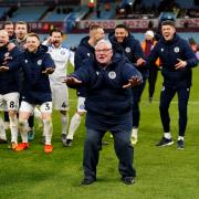 Steve Evans leads the celebrations at Aston Villa in front of the Stevenage fans. Picture: NICK POTTS/PA