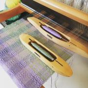 A weaving loom and shuttles from Liliane Textiles in Baldock