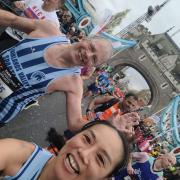 Jim Brown and Fiona Clarke of Fairlands Valley Spartans cross Tower Bridge in the 2023 London Marathon. Picture: FIONA CLARKE