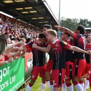 Stevenage players celebrate their first goal with the crowd. Picture: DAVID LOVEDAY/TGS PHOTO