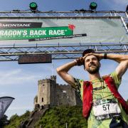 Joy for Hugh after finishing the Dragon's Back Race in first place