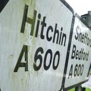 Signs for Hitchin, Shefford and Bedford near the Hertfordshire and Bedfordshire boundary.